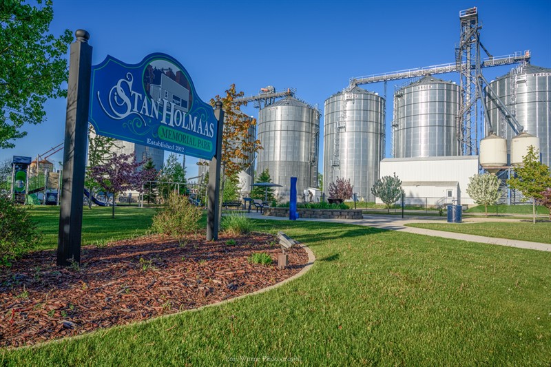 SH Park sign with grain bins in background